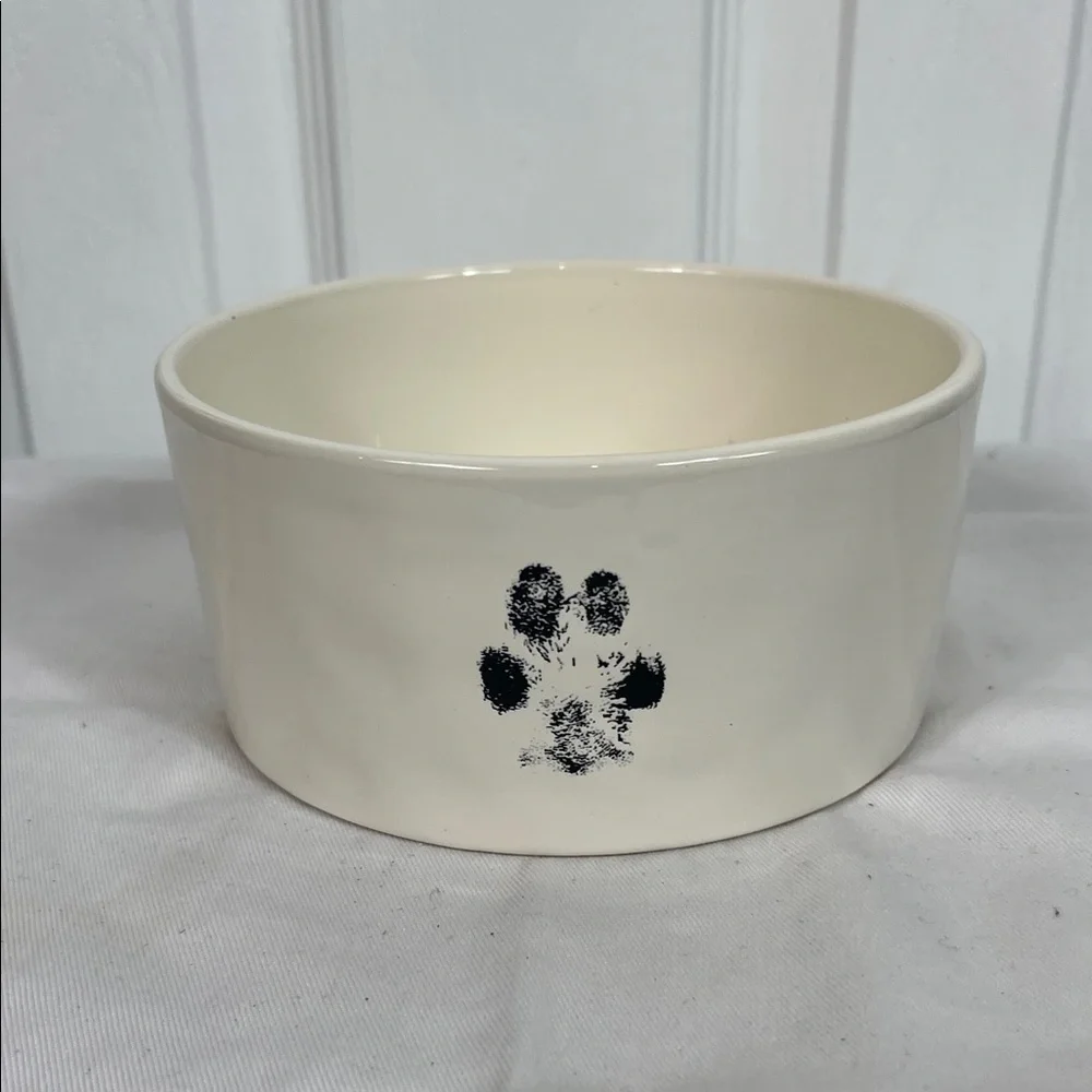 NWOT Rae Dunn white ceramic dog bowl 6” wide, 3” high. Paw print front, Devour
